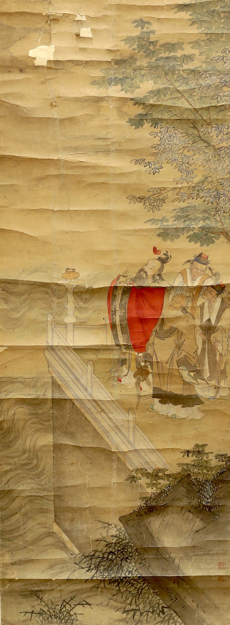 A 19th century Chinese scroll painting on paper of four scholars in a landscape